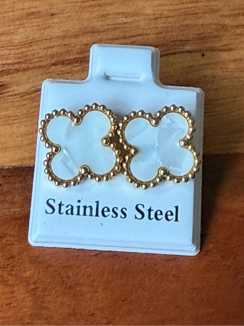 Gold-toned clover (quatrefoil) studs with white faux-mother-of-pearl inlays